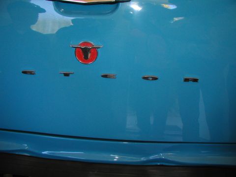 1967 Ford Ranchero - The tailgate of a blue vehicle displays a bull emblem and 'RANCHERO' badging.