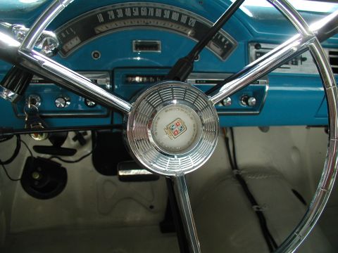 1967 Ford Ranchero - Close-up of the dashboard and steering wheel of a 1956 Ford Fairlane.