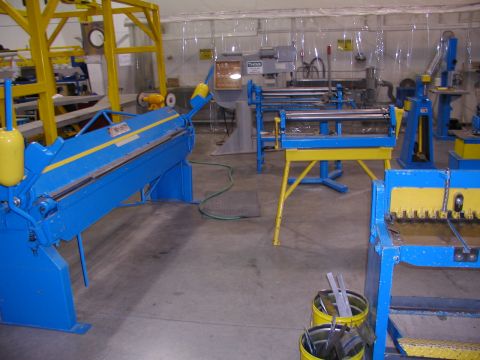 1967 Ford Ranchero - Workshop scene with various industrial metalworking machines, including a brake and shear.