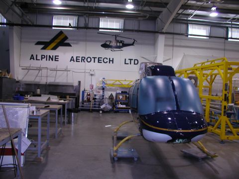 1967 Ford Ranchero - Helicopter fuselage in a workshop, with a logo for Alpine Aerotech Ltd visible on the wall.
