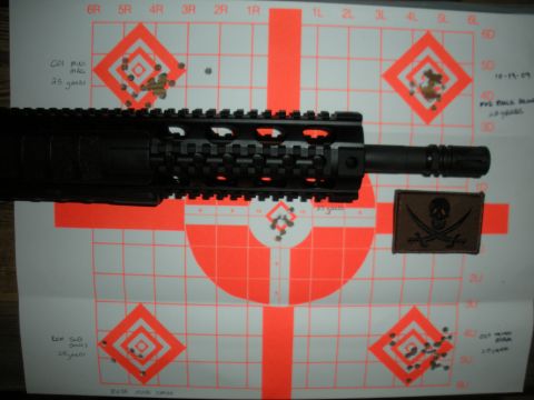 1996 Ford Bronco - A rifle barrel is positioned over several shooting targets, some of which show bullet impacts.