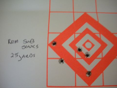 1996 Ford Bronco - A shooting target shows bullet impacts and handwritten notes indicating Remington subsonic ammunition at 25 yards.