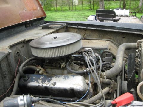 1973 Ford Bronco - Engine bay of a 1973 Ford Bronco shows a V8 engine with an aftermarket air filter assembly.