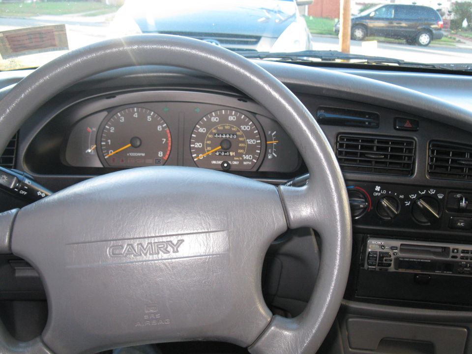 Grey Toyota Camry dashboard with gauge cluster and Sony cassette stereo