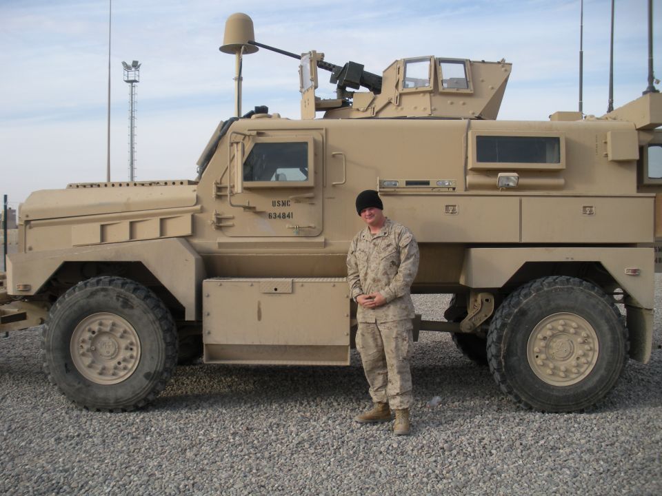 USMC 634841 military truck with a person standing next to it