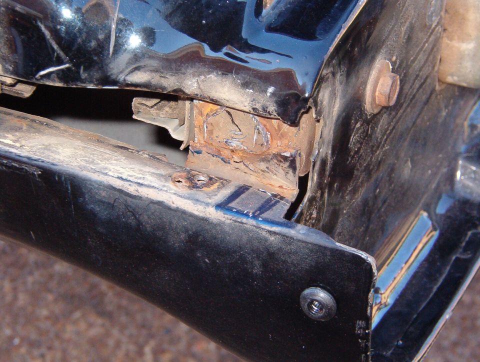 The break is now aligned so I can continue with the main repair.  I removed as much of the old tab from the side reinforcement as I could with a cold chisel.  A 4 1/2" angle grinder with a 1/4" grinding wheel might do a better job.