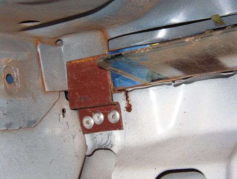 1983 Ford Bronco - Using the predrilled holes as a guide, I installed three 3/16" rivets. The reinforcement where the brace rests isn't flat, but it shou…