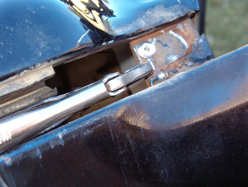 With vise-grips holding it up, I drilled & riveted the side reinforcement to the new brace.  I used three 3/16" rivets here, as before.