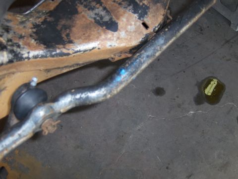 1971 Chevrolet Camaro - Close-up of a rusted vehicle suspension component, likely from the front end.