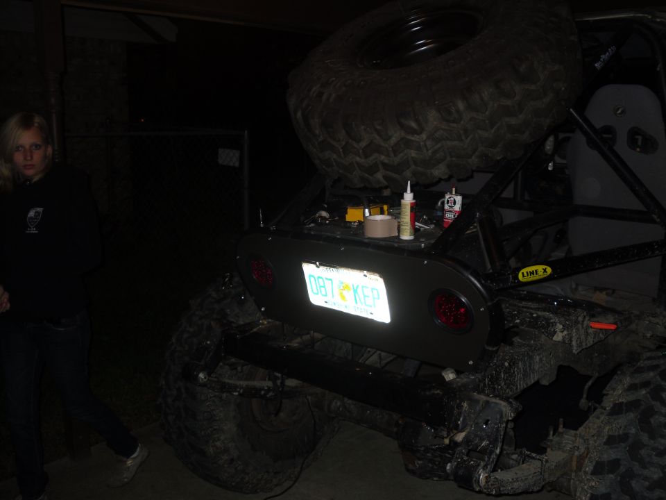 Modified off-road vehicle rear with spare tire and license plate 'DB7 KEP'