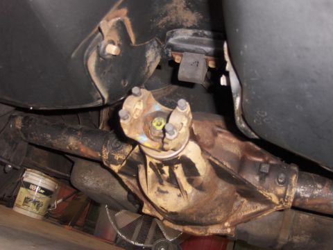 1971 Chevrolet Camaro - Close-up of a vehicle's rear differential and driveshaft, showing signs of wear and rust.