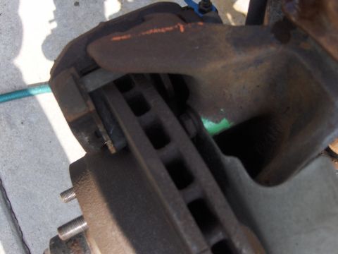 1971 Chevrolet Camaro - This image shows a close-up view of a vehicle's brake system components, including the rotor and caliper.