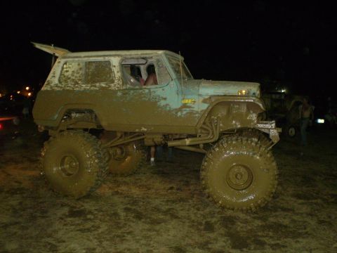 2005 Ford Excursion - This heavily modified Jeep is covered in mud after an off-road event.