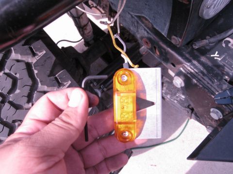 1986 Ford Bronco - Installing a new side marker light, showing wiring and mounting hardware.