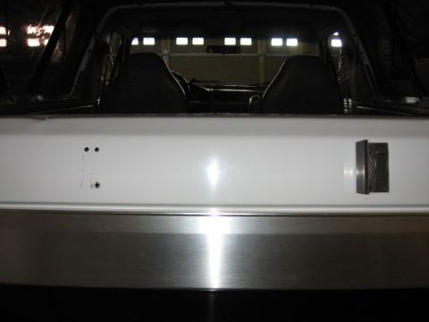 1995 Ford Bronco - Interior view of a white SUV, showing the rear seats and tailgate area.