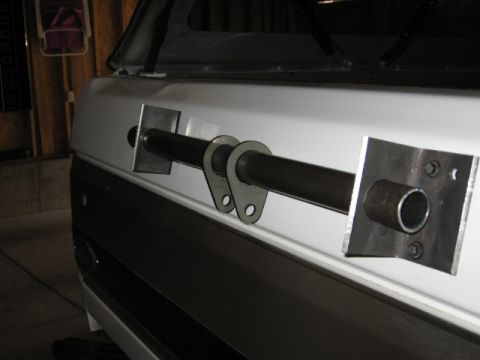 1995 Ford Bronco - Close-up of a custom-fabricated tire carrier mount attached to the vehicle's body.