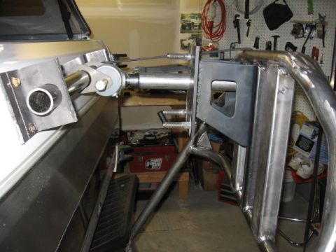 1995 Ford Bronco - Close-up of a custom-fabricated tire carrier mount system on a vehicle's rear.