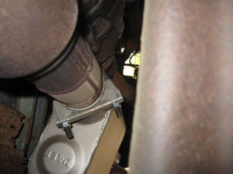 1995 Ford Bronco - Close-up view of an exhaust system component, showing the connection to a catalytic converter with visible 'INLET' text.