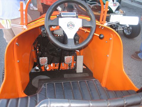 1968 Ford Mustang - Interior view of a custom go-kart, with another vehicle in the background.