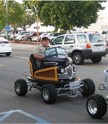 1968 Ford Mustang - A custom-built vehicle resembling a bumper car is driven on a street.