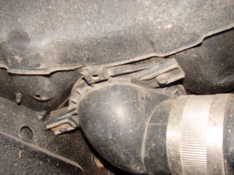 1973 Ford Ranchero - Close-up view of a vehicle's undercarriage showing a hose and clamp assembly.