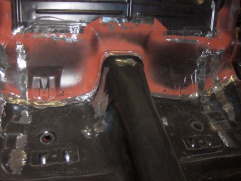 1970 Chevrolet Camaro - This image shows the underside of a vehicle's floor pan, likely undergoing repair or restoration work.