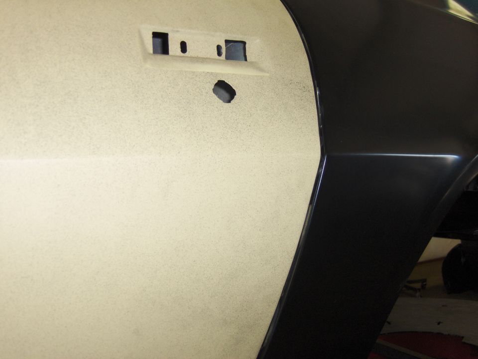 1970 Chevrolet Camaro side panel with door handle holes and black fender