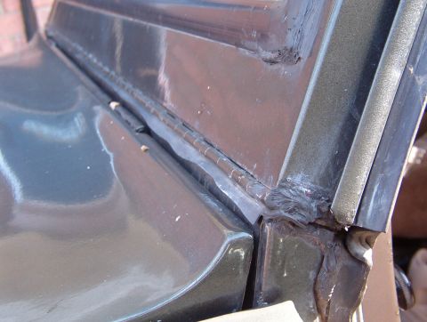 1975 Ford Bronco - The last big rain leak is this hinge. Water drips onto the pedals, and although all this RightStuff has slowed it down, it's not stopped. S…
