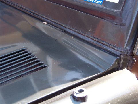 1975 Ford Bronco - The last big rain leak is this hinge. Water drips onto the pedals, and although all this RightStuff has slowed it down, it's not stopped. S…