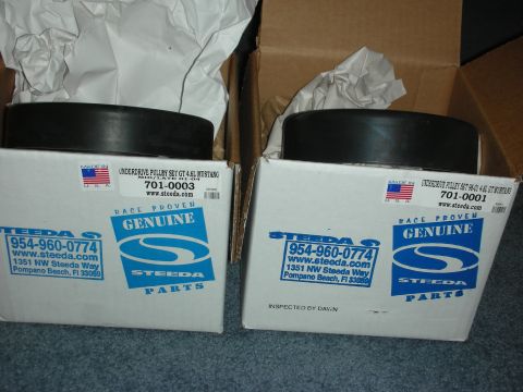 1998 Ford Crown Victoria - Two boxes of Steeda overdrive pulley sets are shown, each containing a pulley.