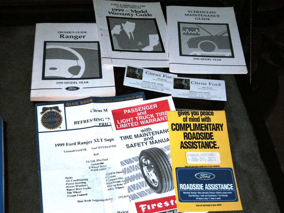 Collection of 1999 Ford Ranger owner's guides and roadside assistance information