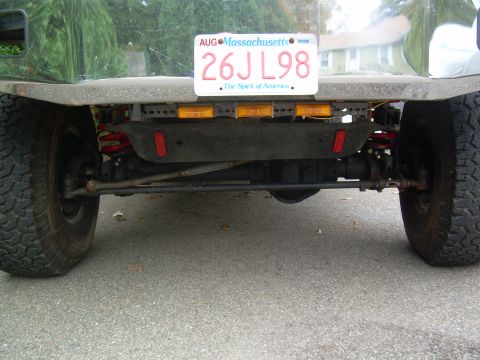 1995 Ford F-150 - The rear axle and suspension components are visible beneath the bumper, with a Massachusetts license plate reading 26JL98.