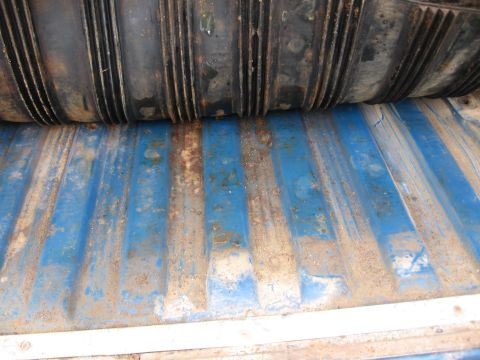1967 Ford Mustang - Close-up of a blue truck bed floor with a black rubber mat. The registry claims 1967 Ford Mustang, but this is not visible.