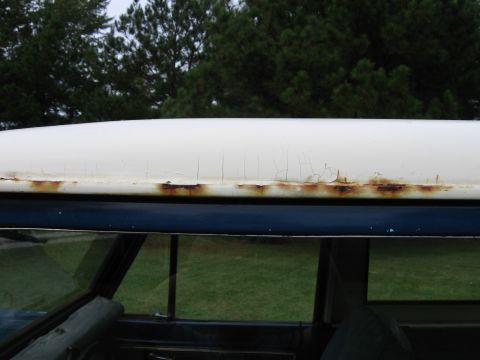 1967 Ford Mustang - Close-up of a vehicle's roofline showing signs of rust and wear.