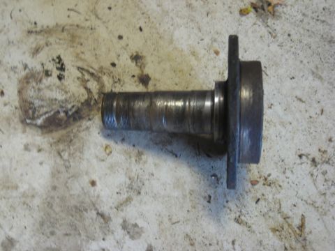1995 Ford Bronco - A close-up view of a used wheel hub spindle, showing wear marks and a threaded shaft.