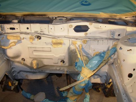 1995 Ford Taurus - The engine bay is prepped and masked for a paint job, with protective coverings in place.