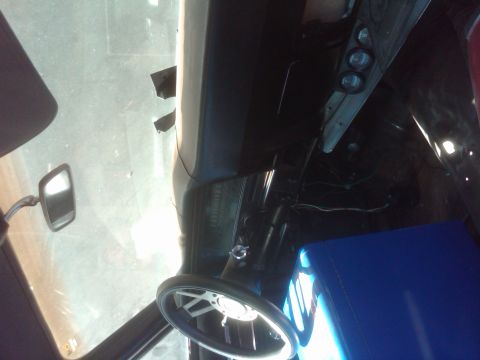 1982 Ford Bronco - Interior view of a vehicle with a steering wheel and dashboard components visible.