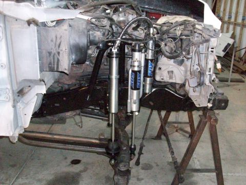 1996 Ford Bronco - Custom front suspension modifications multiple Fox shocks and linkage, likely for off-road use.