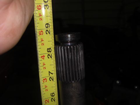 1988 Ford Bronco - A splined shaft is measured with a yellow tape measure, indicating a length of about 28 inches.