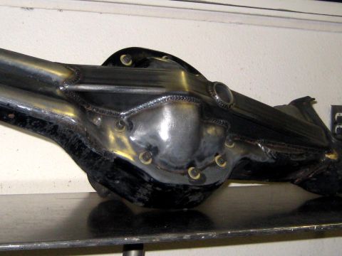 1996 Ford Bronco - A modified rear axle assembly with extensive welding is shown from the side.