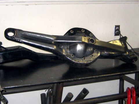1996 Ford Bronco - A custom-fabricated rear axle assembly is shown, likely for a project vehicle, with a polished differential and reinforced arms.