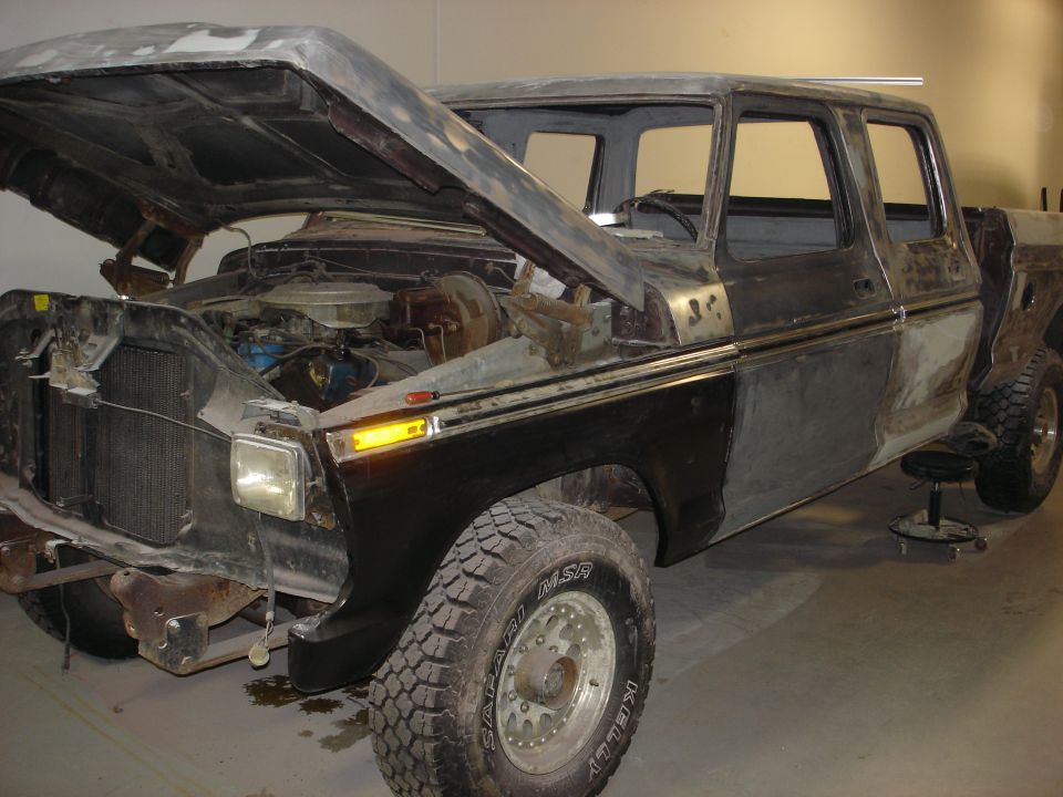 1979 Ford F-250 Crewcab undergoing repairs, hood open, engine exposed