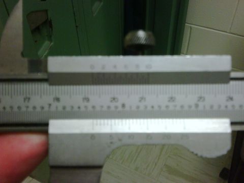 1996 Ford Bronco - A caliper tool is used for precise measurements, showing both inch and millimeter scales.