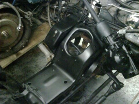 1996 Ford Bronco - The image shows a close-up view of a vehicle's frame, steering components, and part of the transmission.