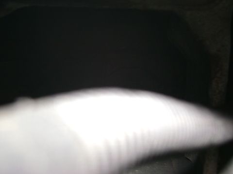 1994 Ford Bronco - A close-up, out-of-focus view of an engine bay, a watermark at the bottom right.