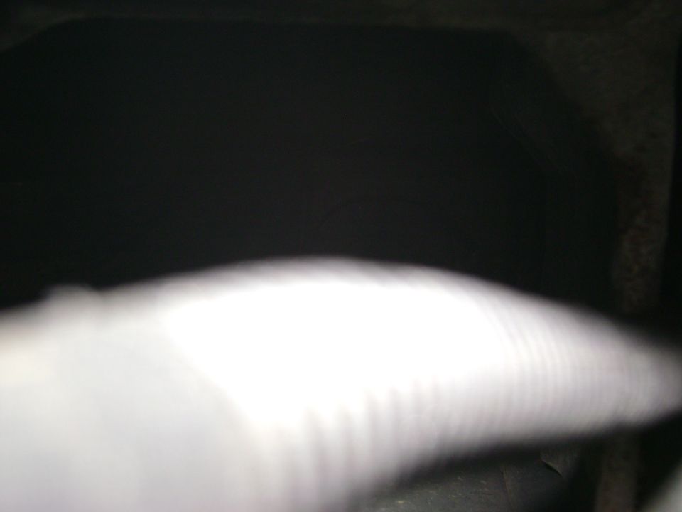blurry shot of engine bay with 'SUPERMOTORS' watermark