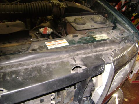 1994 Ford Bronco - Close-up view of the engine bay, showing the radiator cap and coolant reservoir.