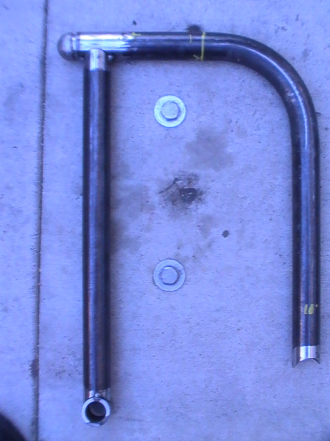 1997 Ford Ranger - A metal tube assembly, possibly a custom part, is shown on a concrete surface.