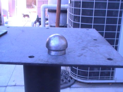 1997 Ford Ranger - A metal cap sits on a flat surface, with an air conditioning unit and pool equipment in the background.