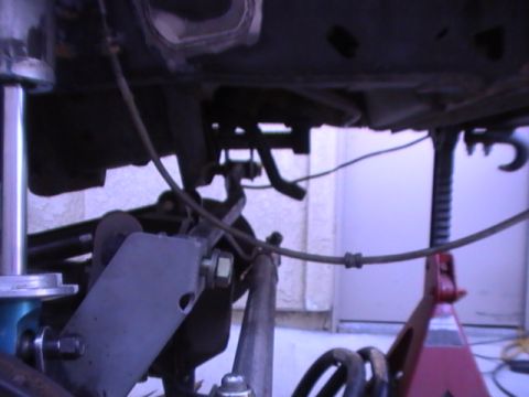 1997 Ford Ranger - Close-up view of the undercarriage of a vehicle, highlighting suspension and frame elements.